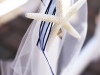 Starfish motif from the invitation is extended to the ceremony decor
