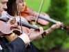 String quartet welcomes guests at the wedding ceremony