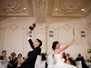 Bride and groom play a game for the guests