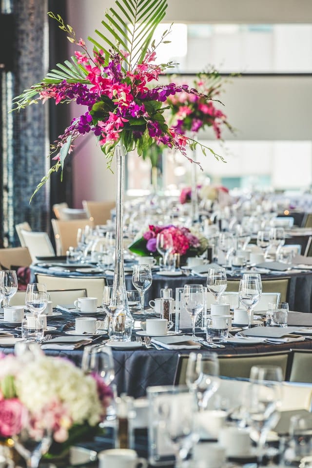 Modern pink and purple tall centrepiece at Malaparte, Toronto. To see more of this modern wedding, visit Rebecca Chan Weddings and Events http://www.rebeccachan.ca