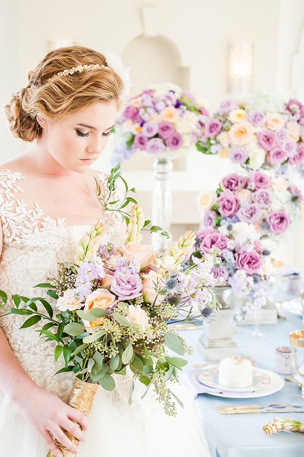 Bride with delicate lace gown and lavender flowers. See more at Rebecca Chan Weddings and Events