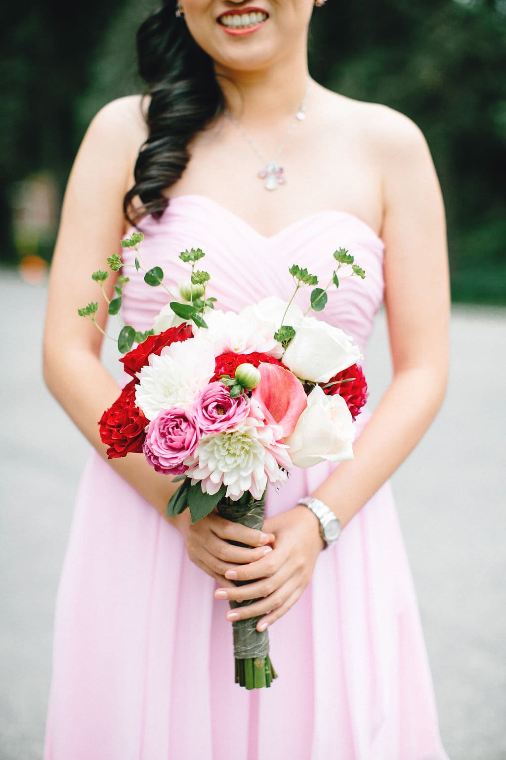 A pink and red combination for this bridesmaid and bouquet. To see more of this modern Chinese wedding, visit Rebecca Chan Weddings and Events http://www.rebeccachan.ca