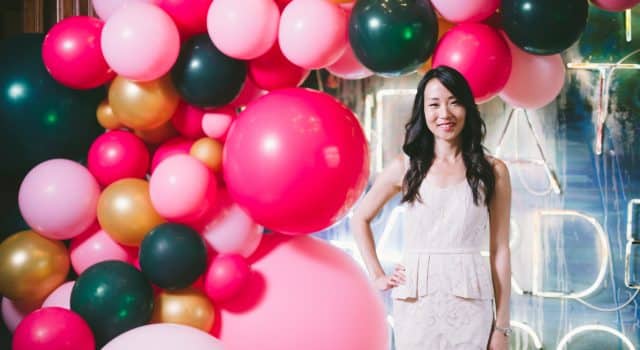 Private party for Rupi Kaur - jewel toned balloon spill