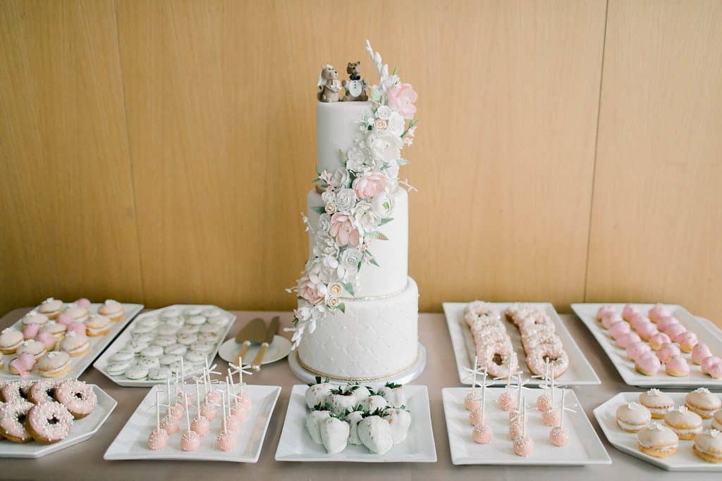 Blush and white sweets table and wedding cake