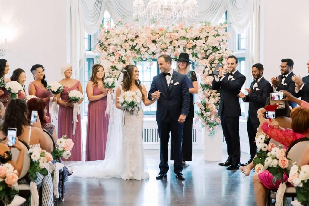 Blush and coral wedding ceremony at Estates of Sunnybrook