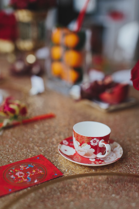Chic Gold and Red Chinese New Year Dinner Party tea cup. See more at Rebecca Chan Weddings and Events https://www.rebeccachan.ca
