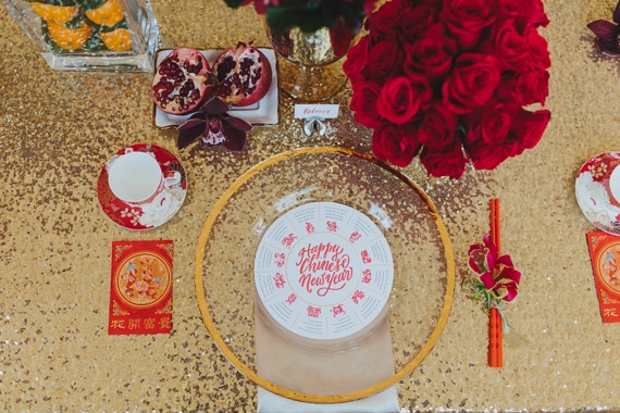 How to style your wedding day with colour - gold, red and tangerine place setting