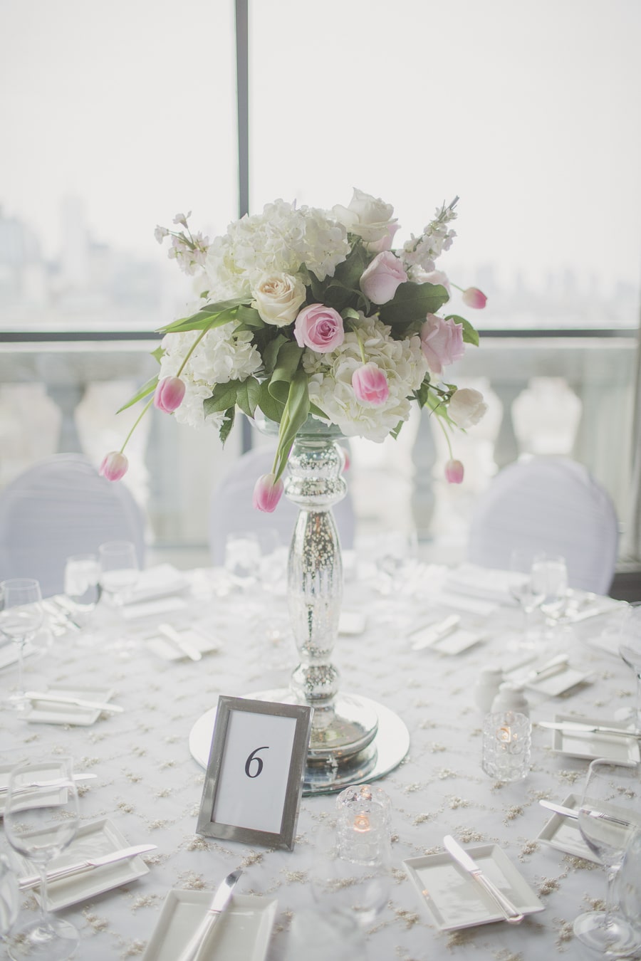 Romantic and modern white and pink centrepieces. See more at Rebecca Chan Weddings and Events https://www.rebeccachan.ca
