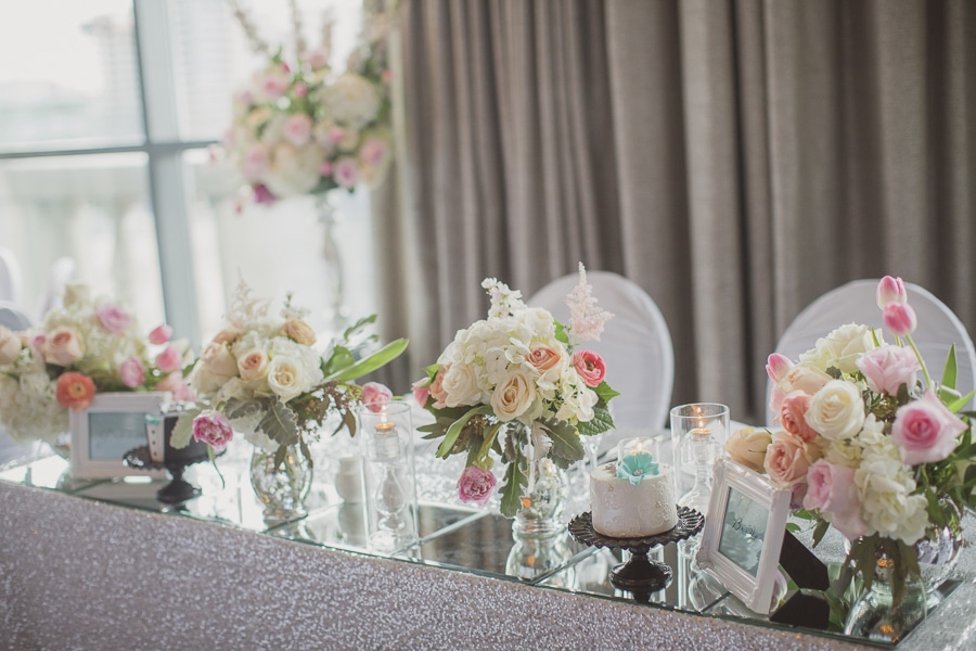 Head table with silver sequinned linen, blush floral and Tiffany-blue accents. See more at Rebecca Chan Weddings and Events https://www.rebeccachan.ca