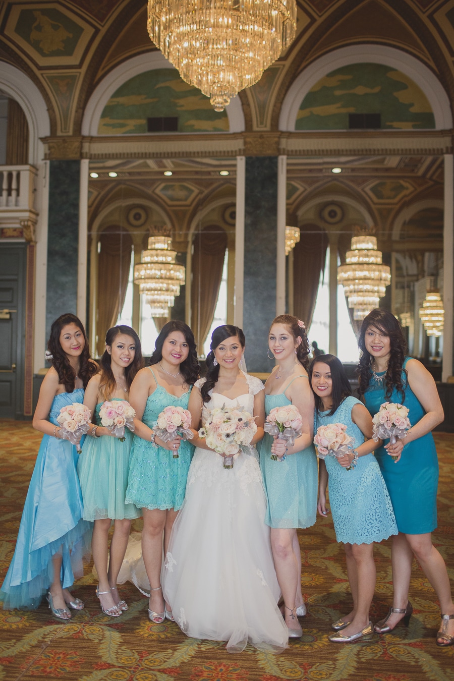 Bride with her bridesmaids in mismatched Tiffany-blue inspired dresses with blush bouquets. See more at Rebecca Chan Weddings and Events https://www.rebeccachan.ca