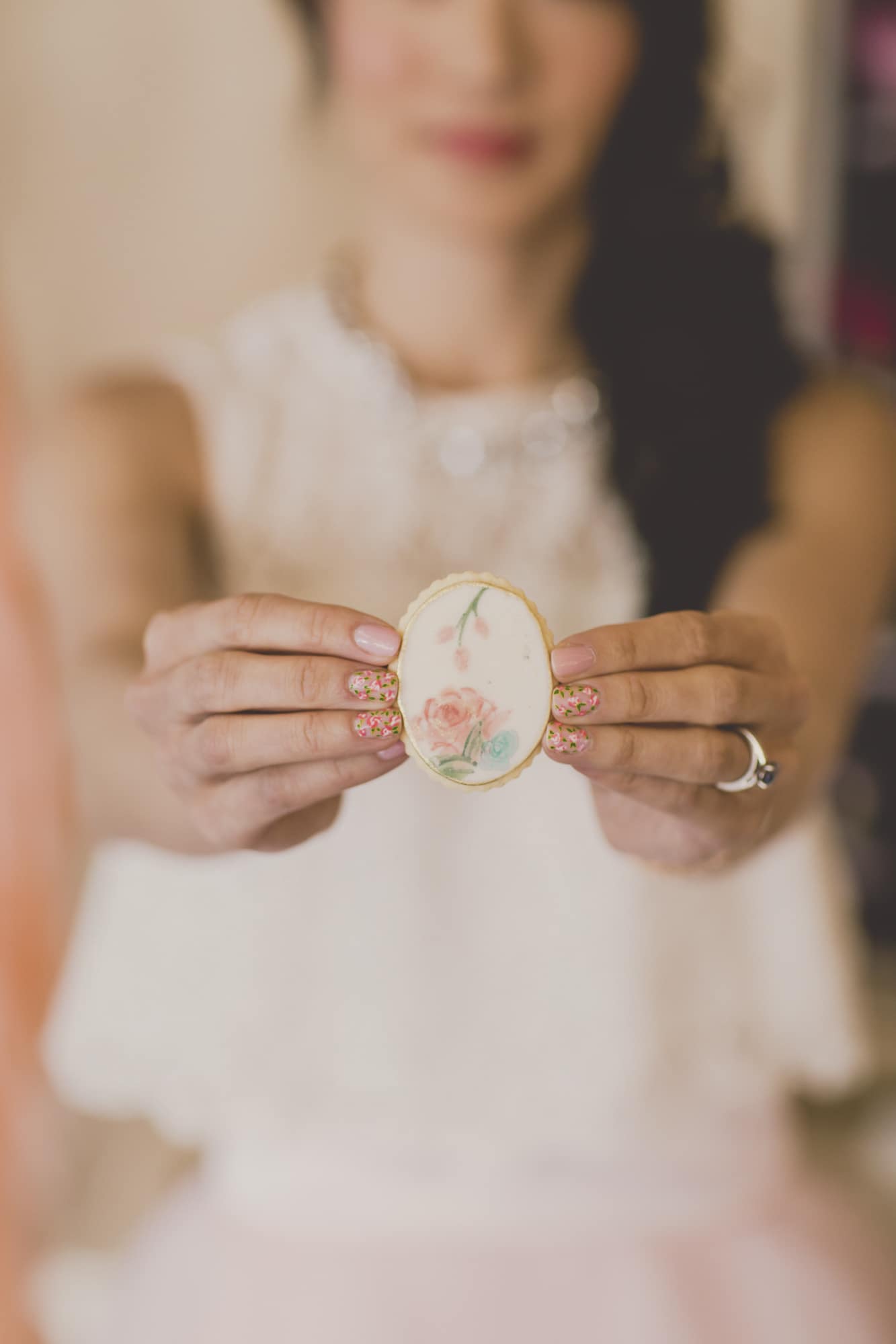 Hand painted cookie, and floral nail art. Coral and Gold Wedding Inspiration - See more at Rebecca Chan Weddings and Events www.rebeccachan.ca
