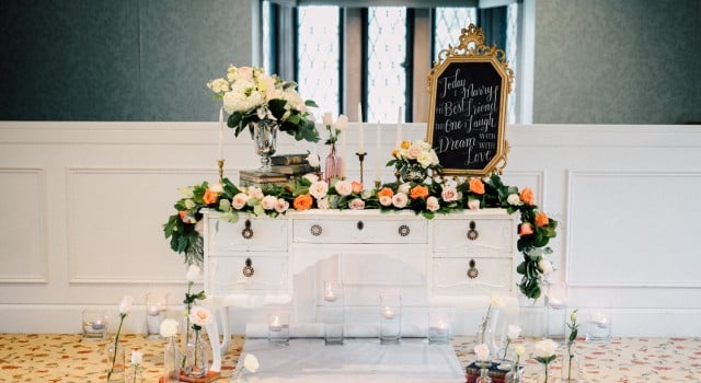 Estates of Sunnybrook indoor ceremony inspiration - floral garland and vintage vanity