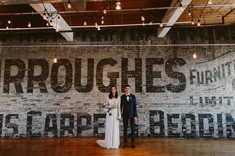 Intimate Burroughes Building wedding with string lights and lavender