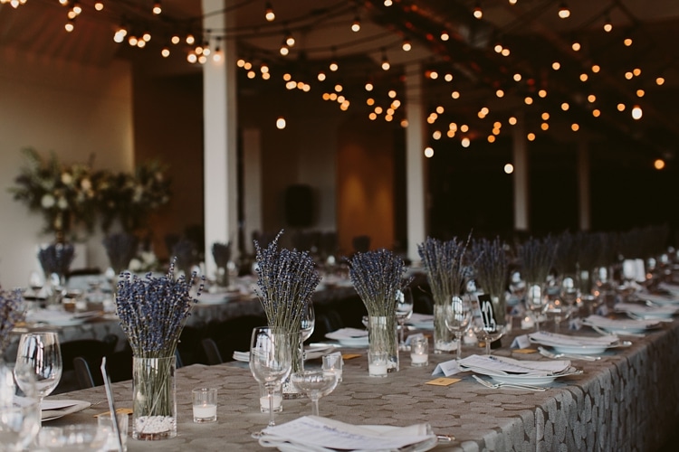 Intimate Burroughes Building wedding with string lights and lavender