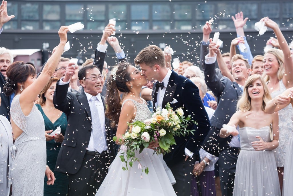 Confetti kiss photo - Romantic Rustic Wedding at the Steam Whistle Brewery
