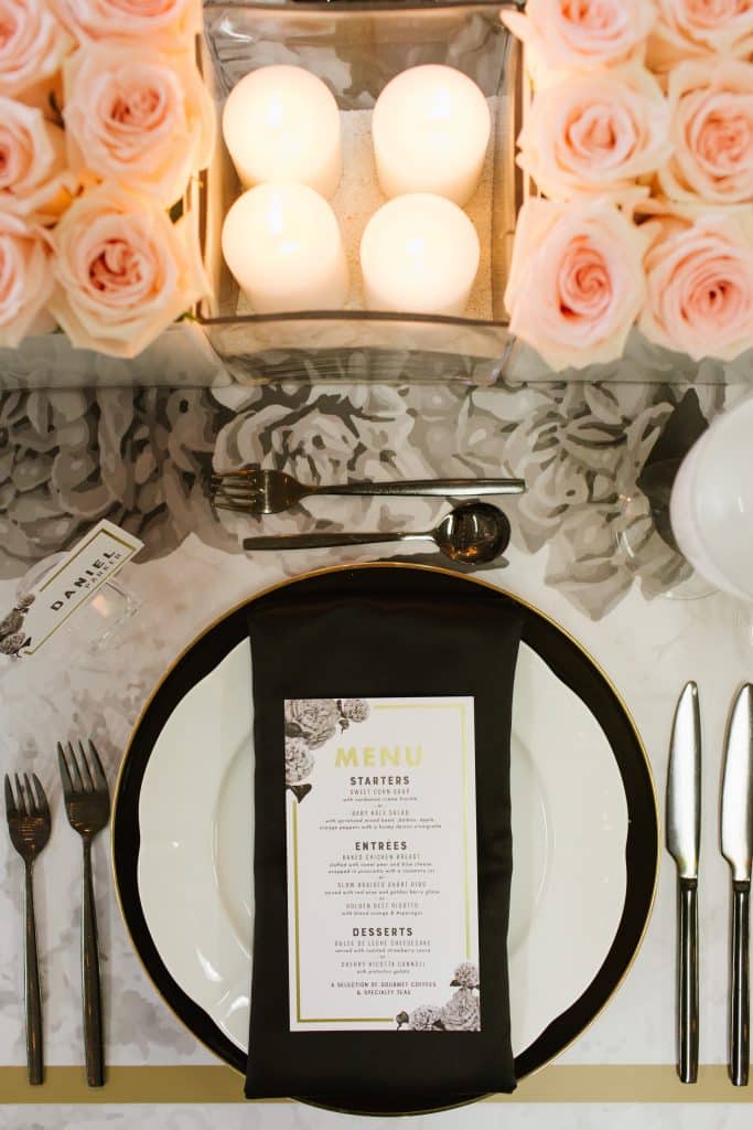 Modern and masculine corporate tabletop design with pink roses and vinyl