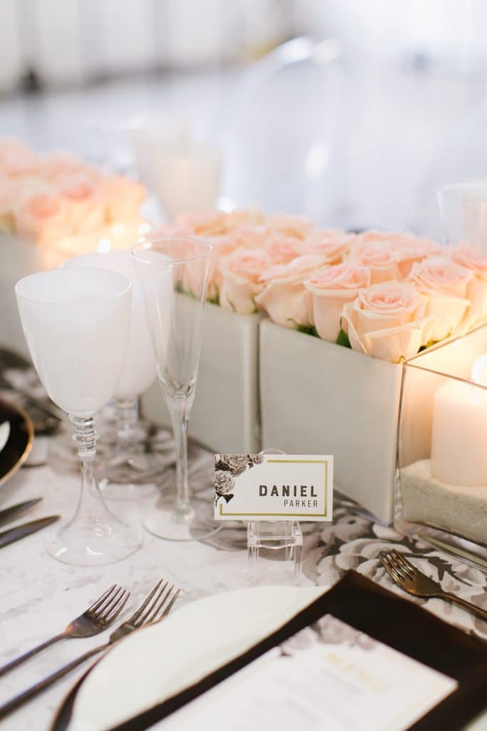 Modern and masculine corporate tabletop design with pink roses and vinyl