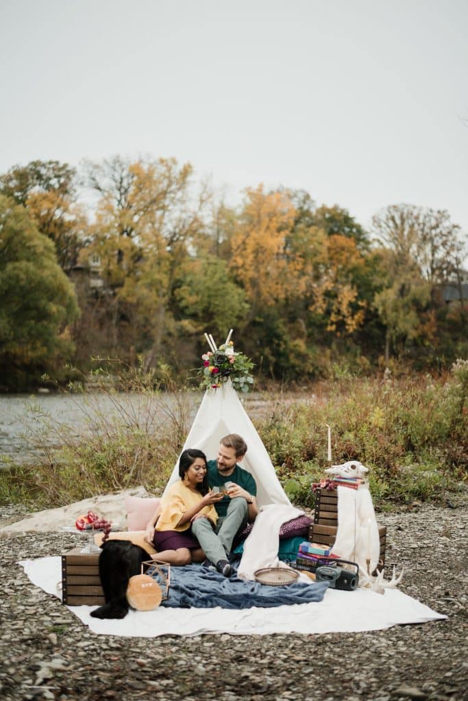Romantic engagement shoot in a canoe with a dog