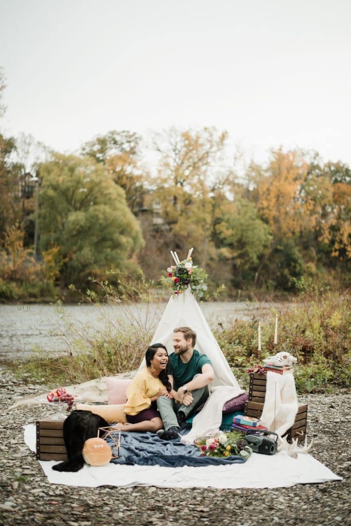 Romantic engagement shoot in a canoe with a dog