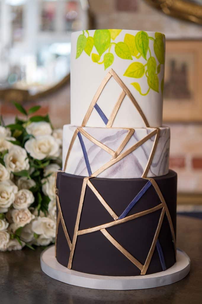 Geometric black and foliage inspired wedding cake