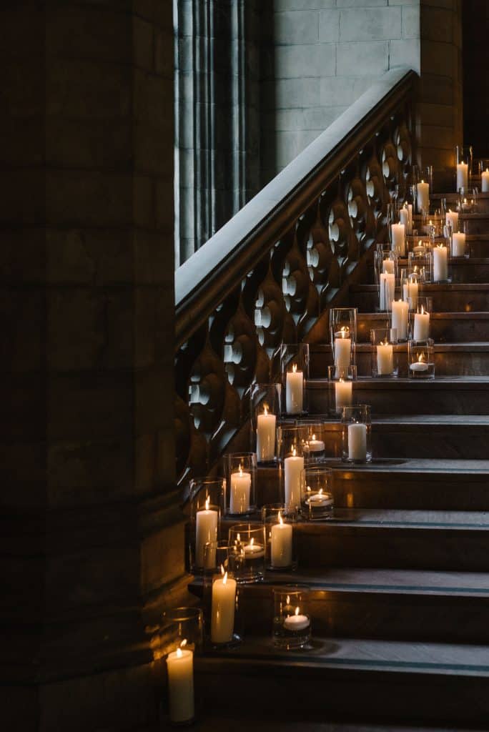 Candlelit stairwell - Modern luxurious all white wedding at Knox College Chapel. Planned by Rebecca Chan Weddings & Events. www.rebeccachan.ca