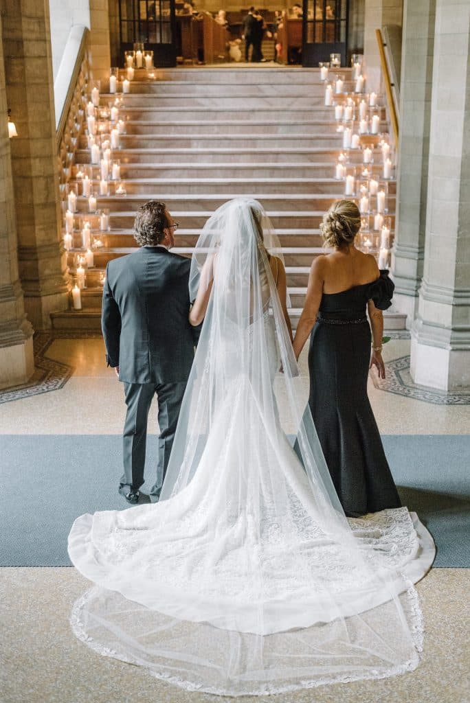 Candlelit stairwell - Modern luxurious all white wedding at Knox College Chapel. Planned by Rebecca Chan Weddings & Events. www.rebeccachan.ca