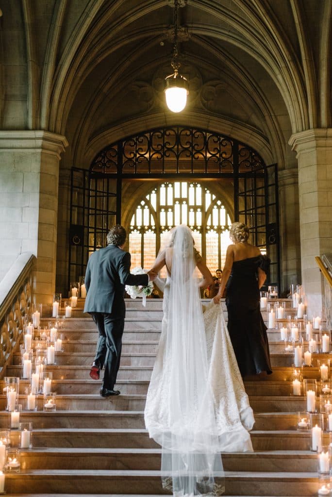 Candlelit stairwell - Modern luxurious all white wedding at Knox College Chapel. Planned by Rebecca Chan Weddings & Events. www.rebeccachan.ca