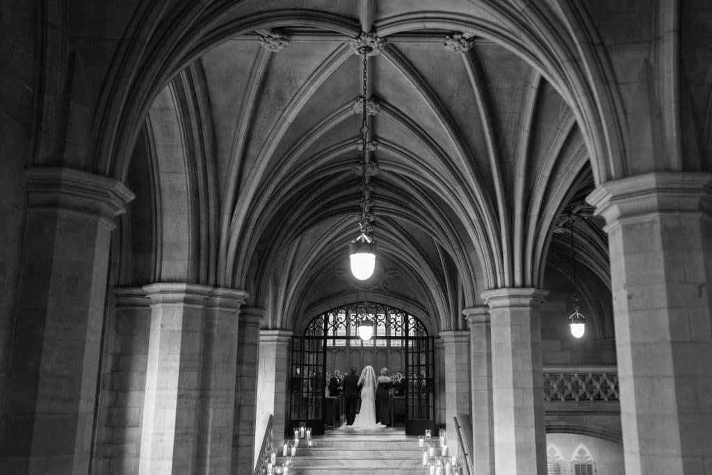 Candlelit stairwell - Modern luxurious all white wedding at Knox College Chapel. Planned by Rebecca Chan Weddings & Events. www.rebeccachan.ca