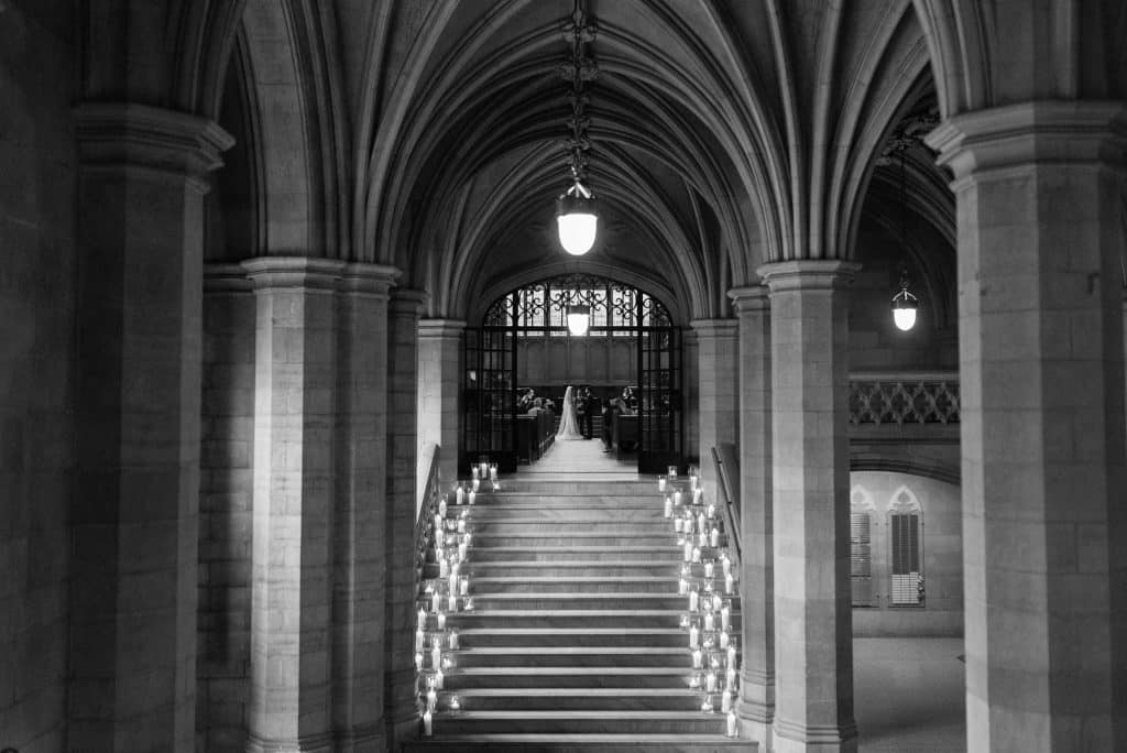 Candlelit stairwell - Modern luxurious all white wedding at Knox College Chapel. Planned by Rebecca Chan Weddings & Events. www.rebeccachan.ca