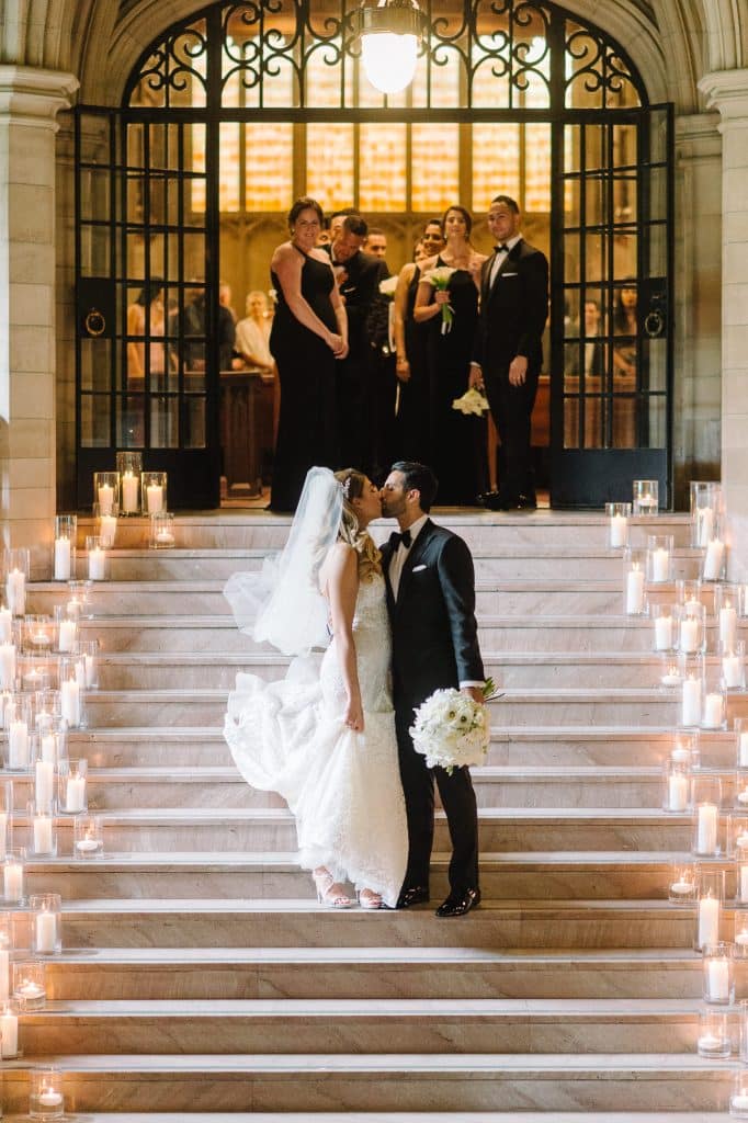 Candlelit stairwell - Modern luxurious all white wedding at Knox College Chapel. Planned by Rebecca Chan Weddings & Events. www.rebeccachan.ca