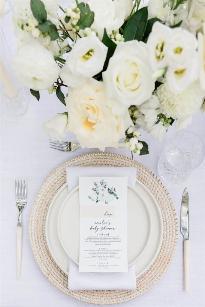 Beautiful all white baby shower decor and place setting.