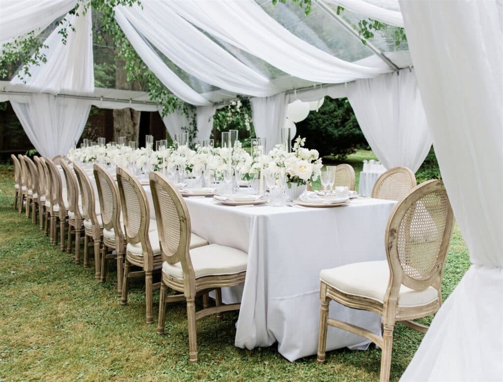 Beautiful all-white tented baby shower decor.
