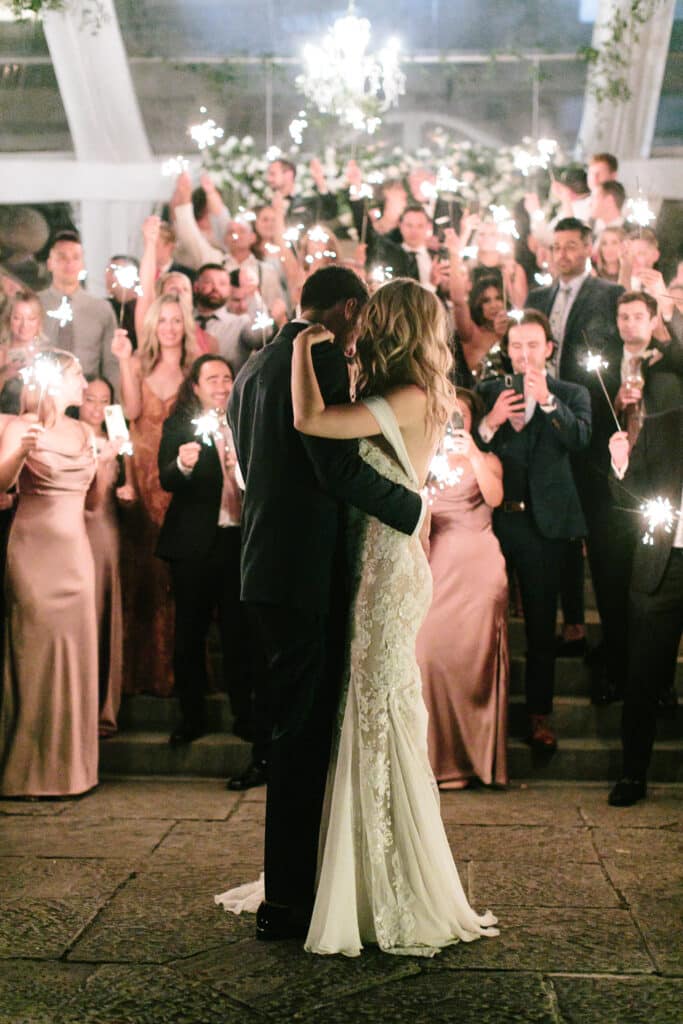 Outdoor wedding reception first dance with sparklers - classic and timeless Graydon Hall Manor Garden wedding. Planning by Rebecca Chan Weddings and Events.