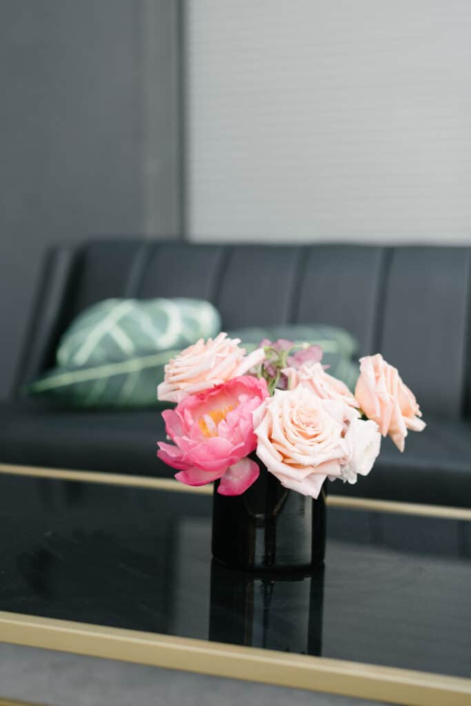 Black and gold furniture with pink flowers