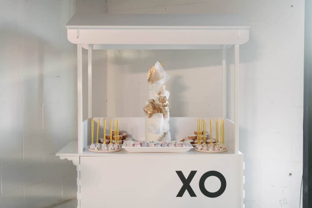 Sweets cart with white, pink and gold dessert