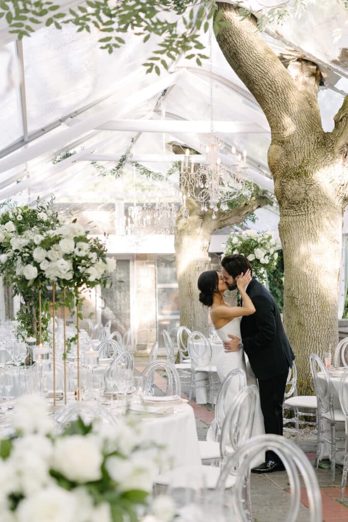 Graydon Hall Manor Wedding - Reception on the Terrace with white roses and greenery. Planned by Rebecca Chan Weddings & Events
