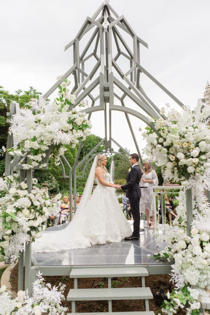 Classic Casa Loma Wedding Ceremony with white roses. Planned by Rebecca Chan Weddings & Events