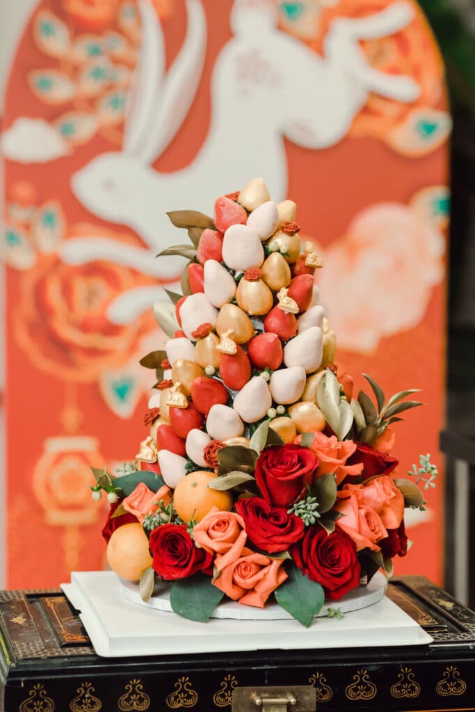 Lunar new year red and pink chocolate dipped strawberry tower with flowers.
