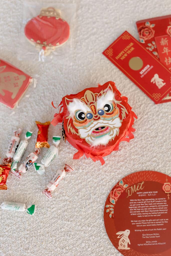 Olay influencer custom designed influencer mailer, Lunar new year themed. Chinese lion head pinata.