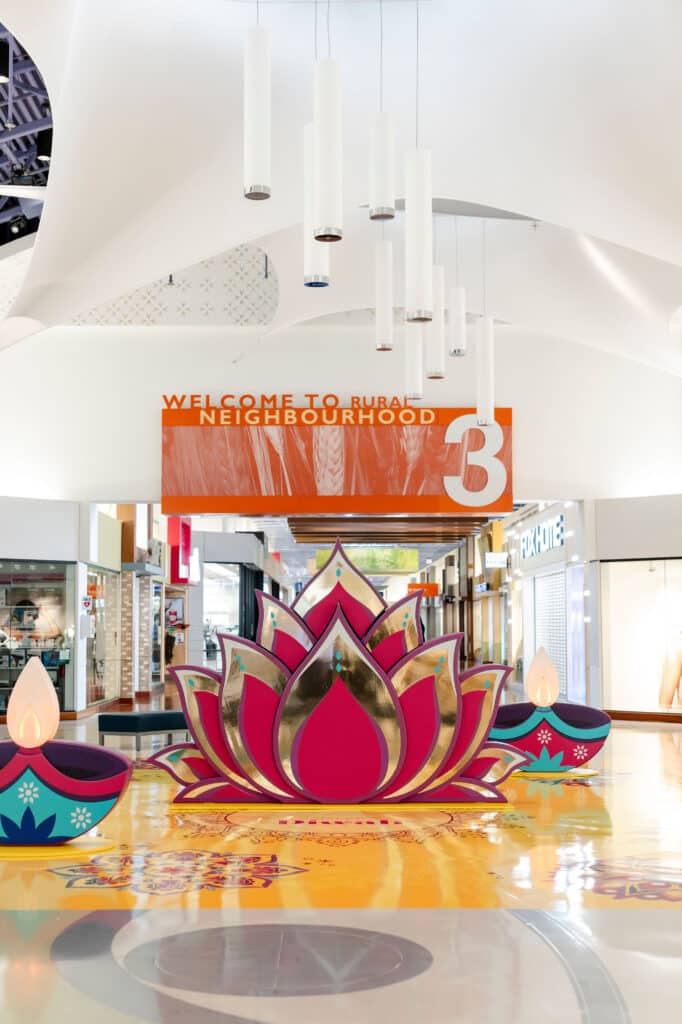Toronto mall activation celebrating Diwali - A beautiful lotus design with 3D diya candles and vibrant rangoli pattern floor vinyl